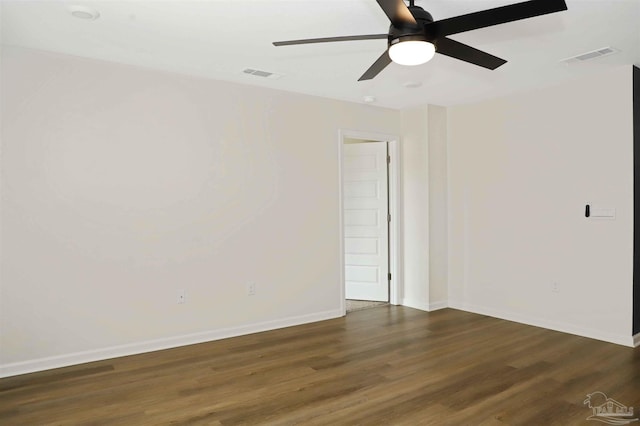 unfurnished room with dark hardwood / wood-style floors and ceiling fan