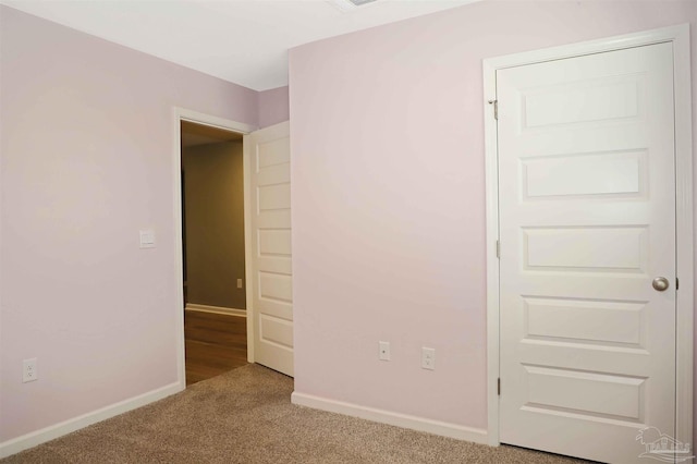 empty room featuring light carpet