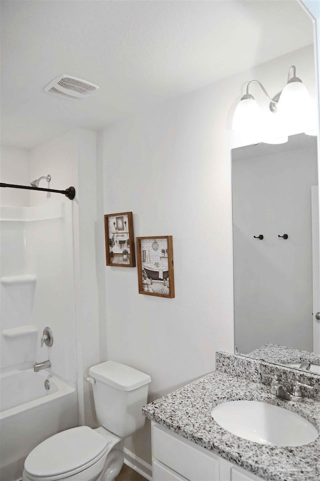 full bathroom with vanity, bathing tub / shower combination, and toilet