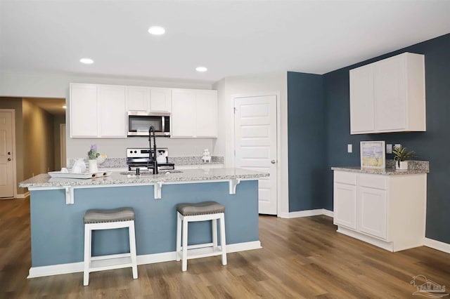 kitchen featuring white cabinetry, appliances with stainless steel finishes, and sink