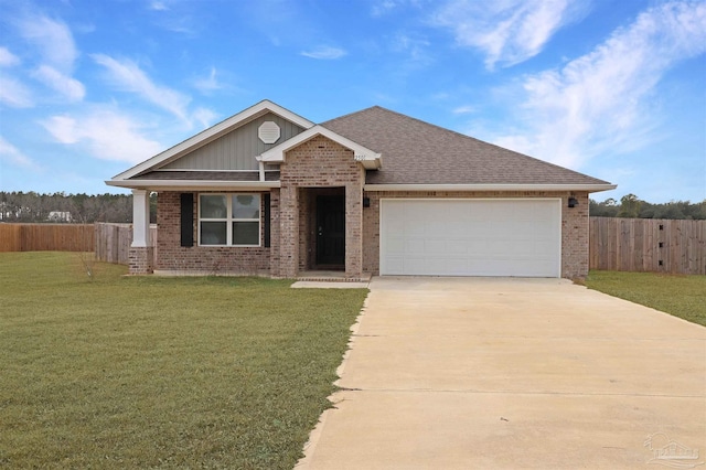 view of front of house with a garage and a front yard