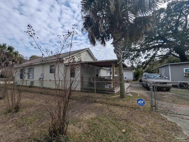 view of front of home featuring a gate and fence