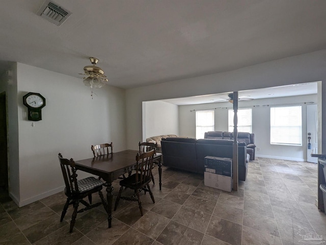 dining space with a ceiling fan, visible vents, and baseboards