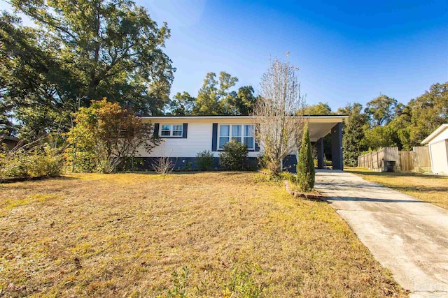 ranch-style home with a front lawn and a carport