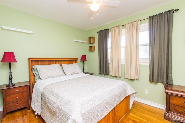 bedroom featuring light wood-type flooring and ceiling fan