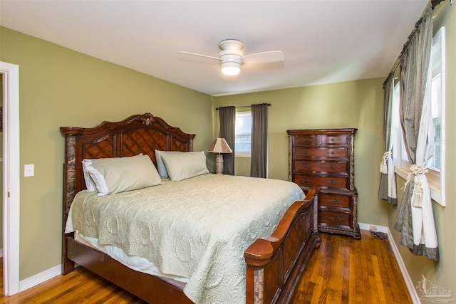 bedroom featuring dark hardwood / wood-style flooring and ceiling fan