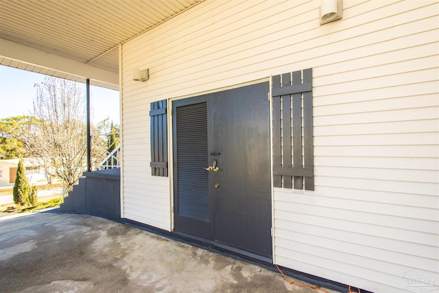 doorway to property with a patio