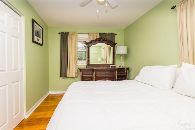 bedroom with hardwood / wood-style floors and ceiling fan