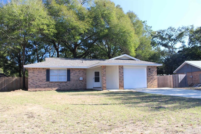 ranch-style home with an attached garage, fence, and brick siding