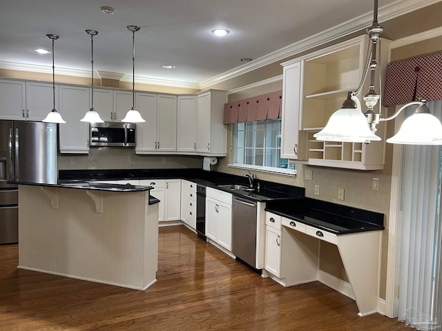 kitchen with dark countertops, a sink, appliances with stainless steel finishes, and open shelves