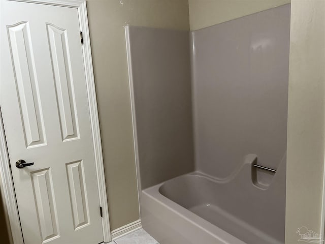 full bathroom featuring a shower and a washtub