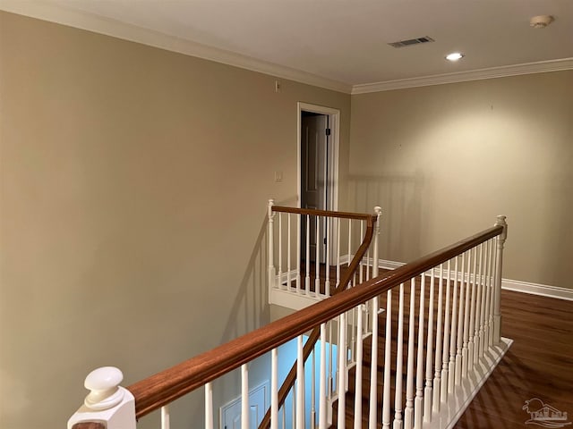 stairway featuring wood finished floors, baseboards, visible vents, recessed lighting, and ornamental molding