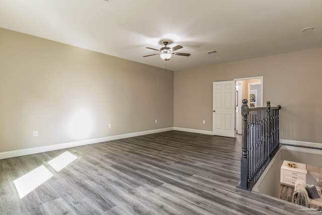 unfurnished room with ceiling fan and hardwood / wood-style floors