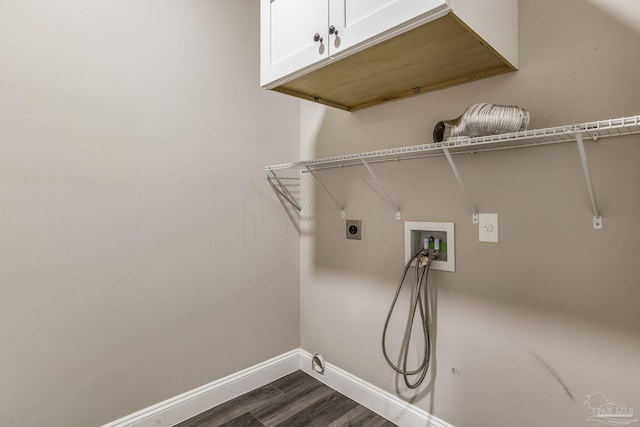 clothes washing area with cabinets, washer hookup, dark wood-type flooring, and hookup for an electric dryer