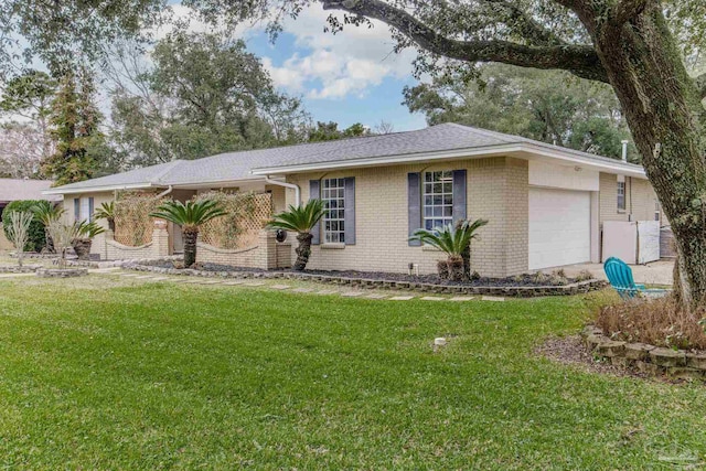 ranch-style home with a garage, a front yard, and brick siding