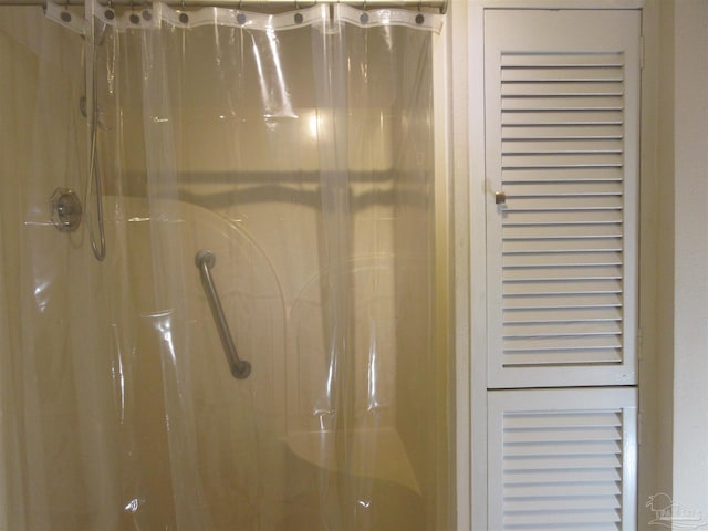 bathroom featuring a shower stall