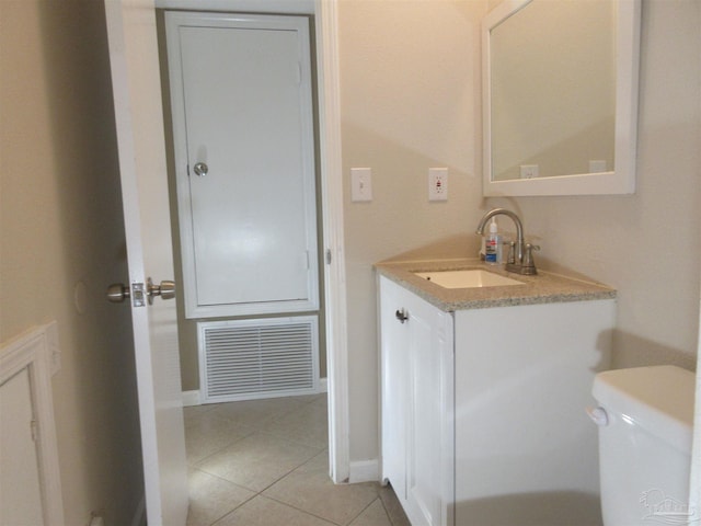 bathroom with visible vents, tile patterned flooring, vanity, and toilet