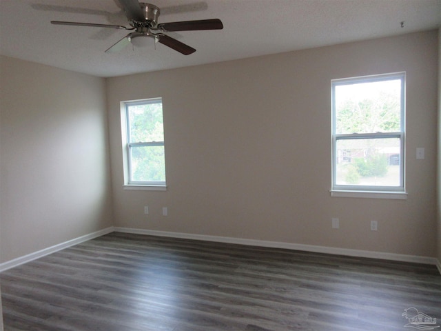unfurnished room featuring ceiling fan, baseboards, and wood finished floors