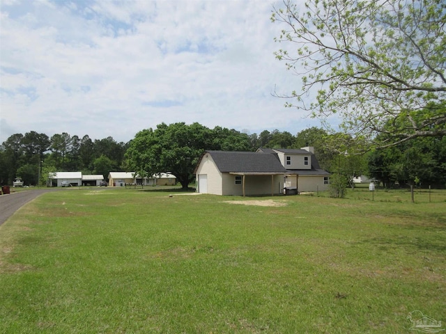 view of yard featuring an attached garage