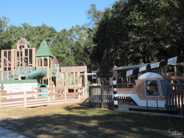 communal playground featuring fence