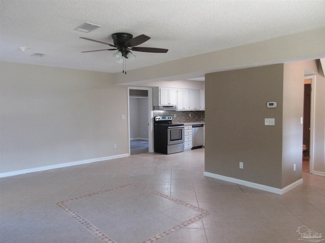 unfurnished living room featuring ceiling fan, baseboards, light tile patterned flooring, and visible vents