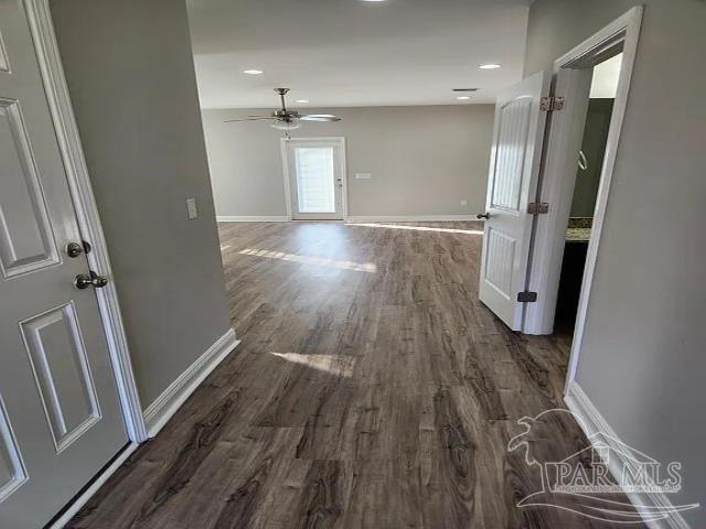 hallway featuring dark hardwood / wood-style flooring