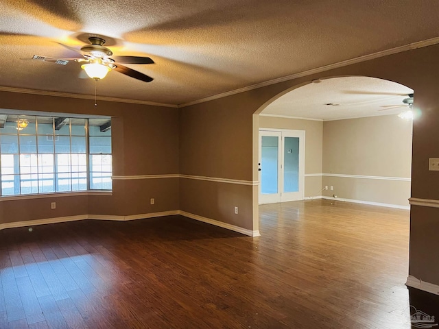 empty room featuring wood-type flooring, a textured ceiling, ceiling fan, and crown molding