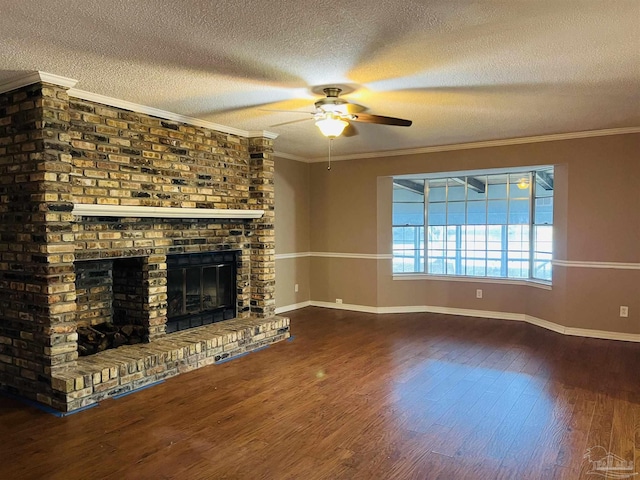 unfurnished living room with a brick fireplace, a textured ceiling, ceiling fan, and crown molding