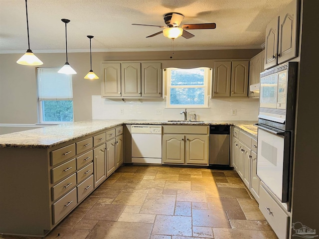 kitchen with white appliances, kitchen peninsula, pendant lighting, tasteful backsplash, and sink