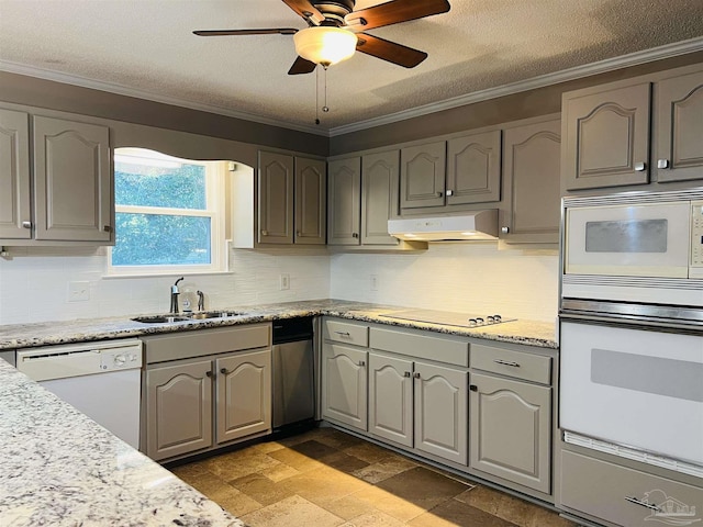 kitchen featuring white appliances, ceiling fan, ornamental molding, a textured ceiling, and sink