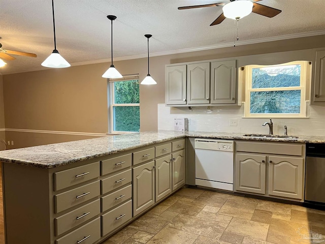 kitchen with pendant lighting, dishwasher, and tasteful backsplash