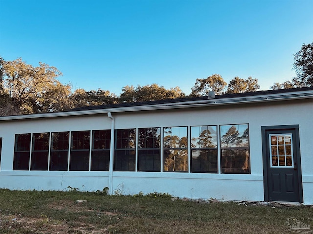 view of home's exterior with a lawn