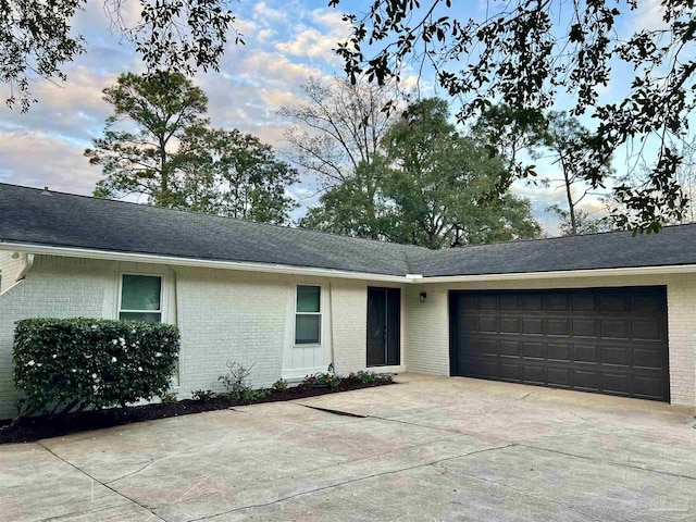 ranch-style house featuring a garage