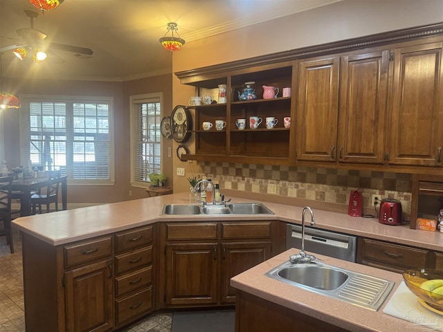 kitchen featuring dark brown cabinetry, sink, tasteful backsplash, ornamental molding, and ceiling fan