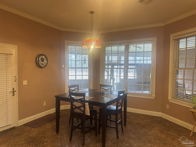 dining space with crown molding