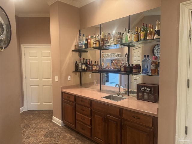 bar with crown molding and sink