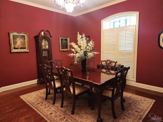 dining room with crown molding, hardwood / wood-style flooring, and a chandelier