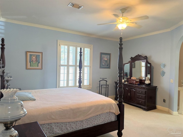 carpeted bedroom with crown molding and ceiling fan