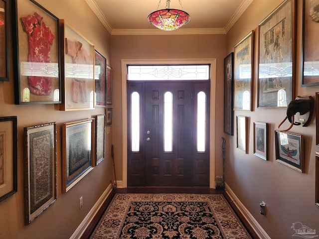 foyer entrance featuring ornamental molding