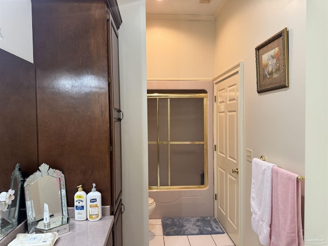 bathroom with enclosed tub / shower combo, ornamental molding, tile patterned floors, and toilet