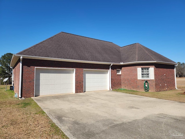 view of front facade with a garage and a front lawn