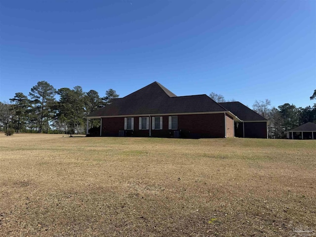 view of property exterior featuring a lawn