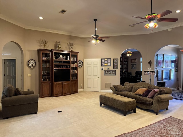 living room featuring crown molding, light colored carpet, and ceiling fan