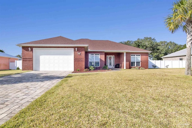 single story home featuring a front yard and a garage