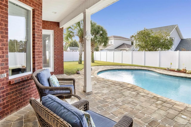 view of pool featuring a patio