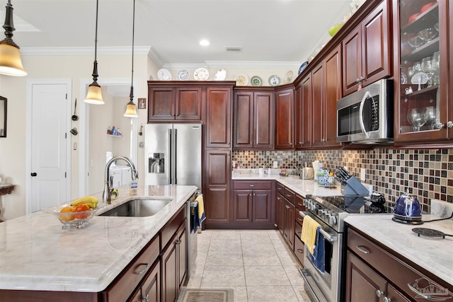 kitchen with appliances with stainless steel finishes, decorative light fixtures, crown molding, and sink