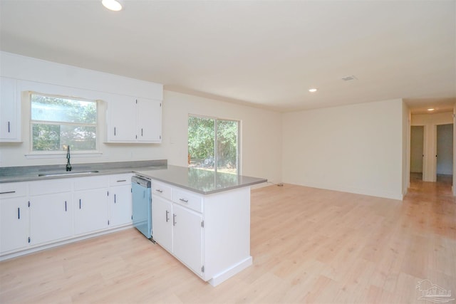 kitchen with dishwasher, light wood-type flooring, and white cabinets