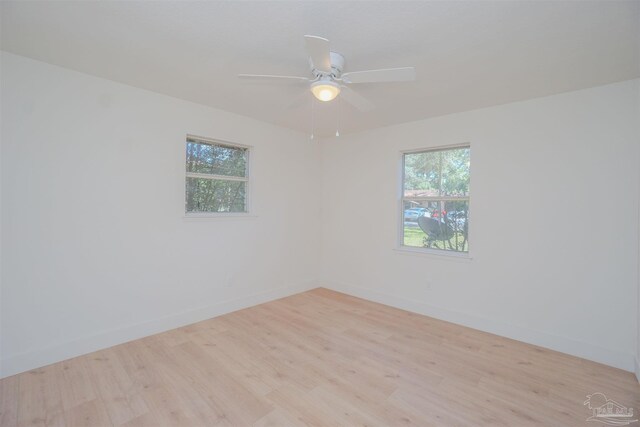 spare room featuring ceiling fan and light hardwood / wood-style floors