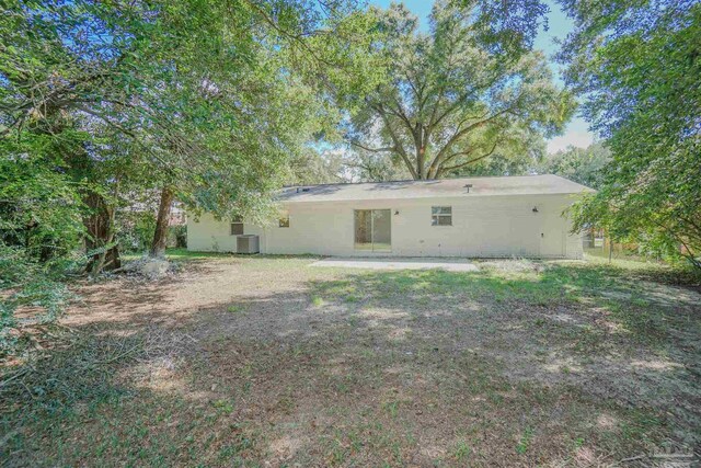 rear view of property featuring cooling unit and a patio