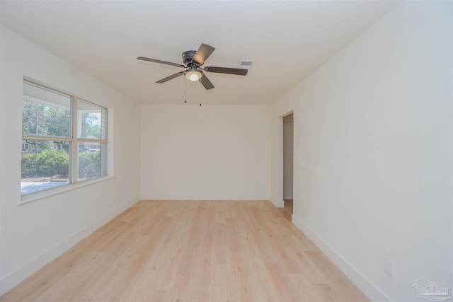 unfurnished room with ceiling fan and light wood-type flooring